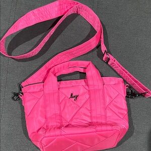 New never used Lug Magenta Quilted Dori Mini crossbody with tote handles.